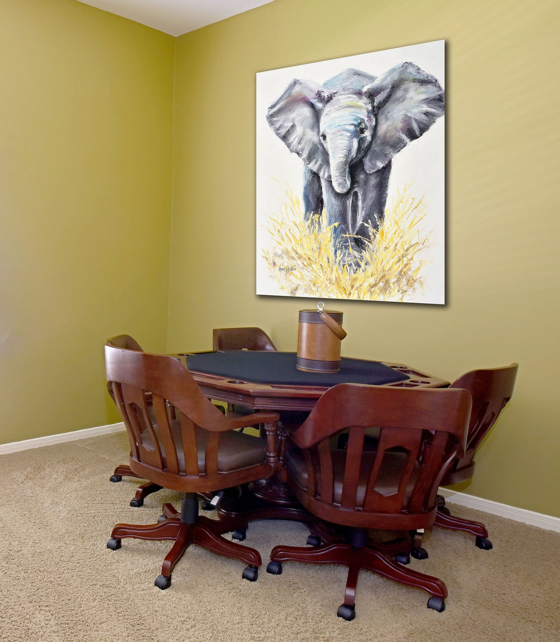 Large baby elephant canvas art print hanging in a game room