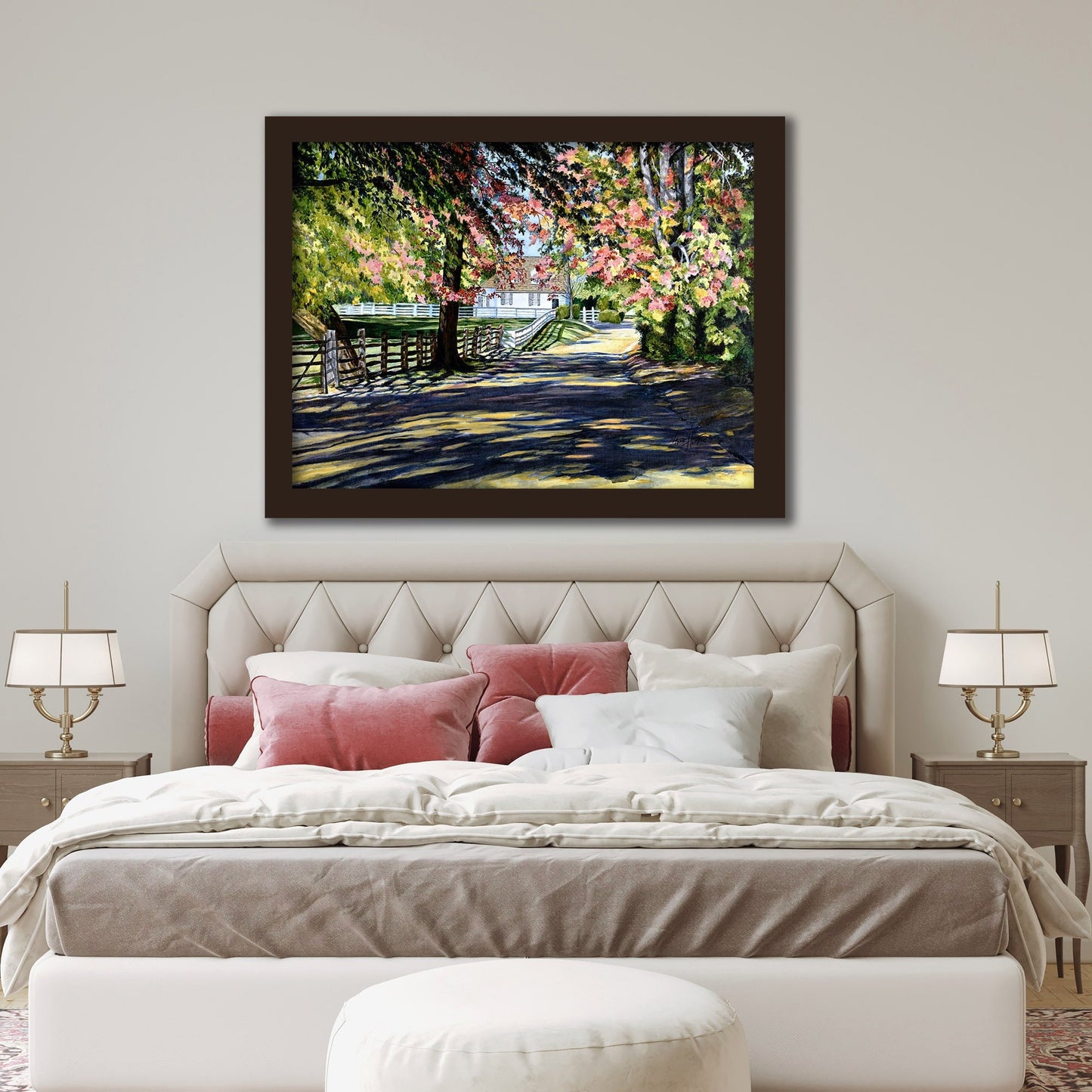 Oil painting print of a country road landscape with colorful foliage hanging above a bed.